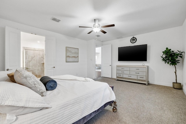 carpeted bedroom featuring baseboards, visible vents, ceiling fan, and connected bathroom