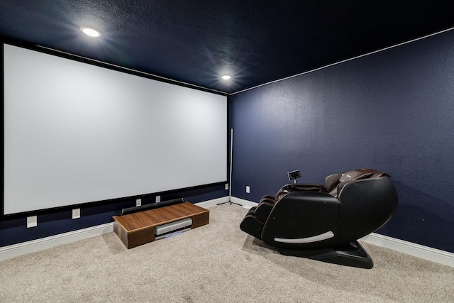 carpeted home theater with a textured ceiling, recessed lighting, and baseboards