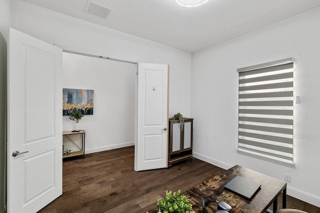 office featuring dark wood-style floors, baseboards, and visible vents