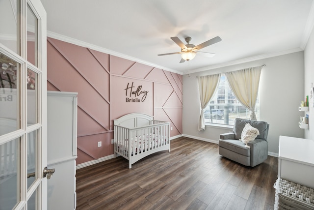 bedroom with ornamental molding, dark wood-style flooring, a ceiling fan, and baseboards