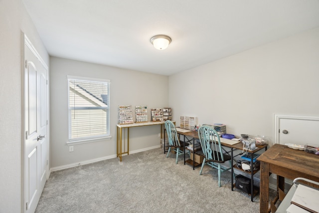 office space featuring light colored carpet and baseboards