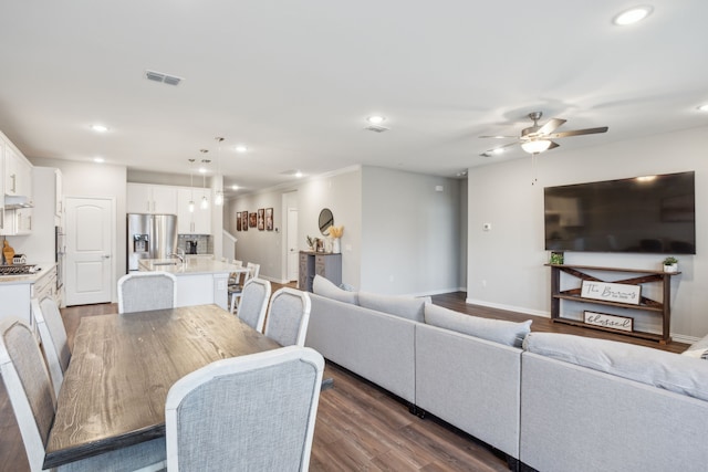 dining space with baseboards, visible vents, ceiling fan, dark wood-style flooring, and recessed lighting