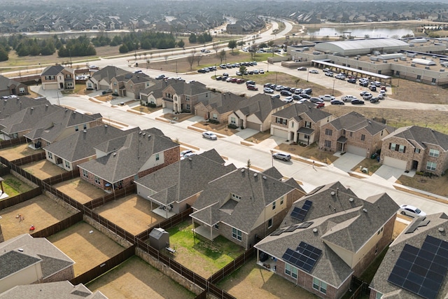 bird's eye view with a residential view and a water view