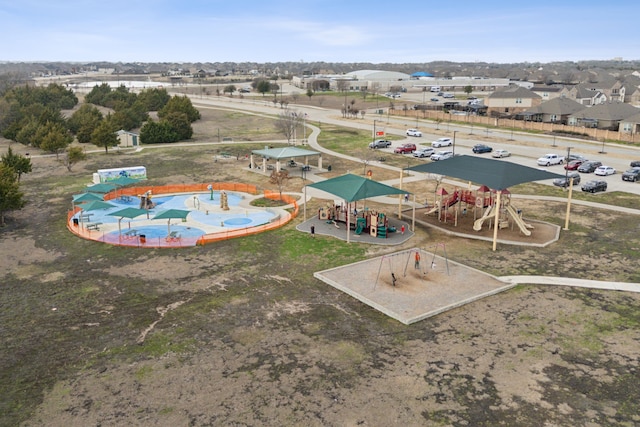 birds eye view of property with a residential view