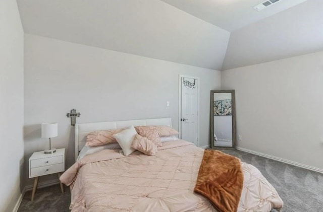 bedroom with baseboards, visible vents, vaulted ceiling, and carpet flooring