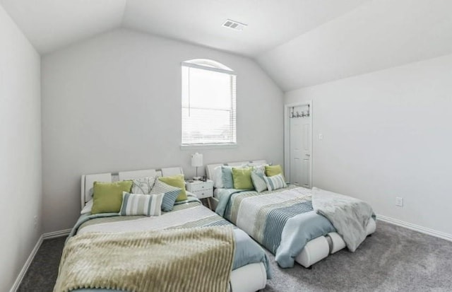 carpeted bedroom with vaulted ceiling, visible vents, and baseboards