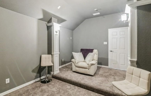 living area featuring carpet, vaulted ceiling, and baseboards