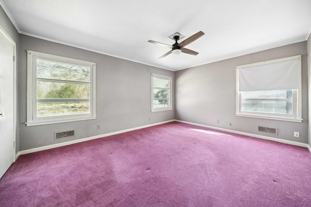 spare room featuring carpet floors, ornamental molding, and ceiling fan