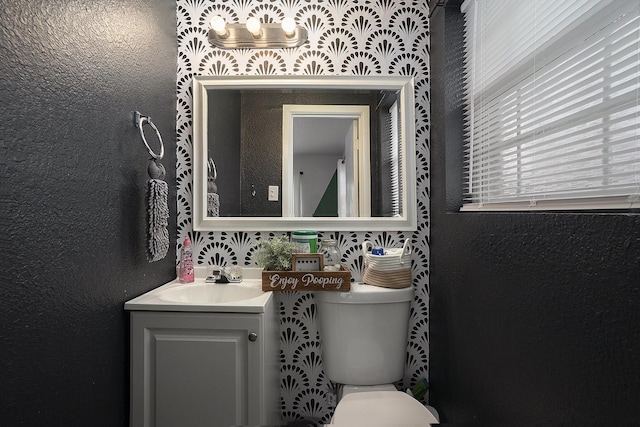 bathroom with vanity and toilet