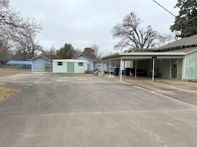 exterior space featuring driveway and a carport