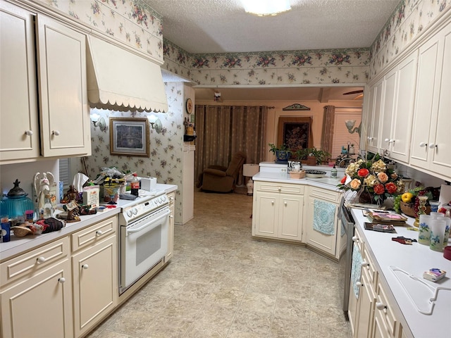 kitchen with wallpapered walls, light countertops, white electric range oven, and a textured ceiling