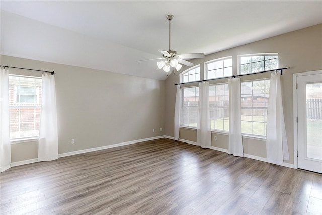 1720 Willow Crk, Mesquite, TX 75181 - unfurnished room with a healthy amount of sunlight, baseboards, a ceiling fan, and wood finished floors