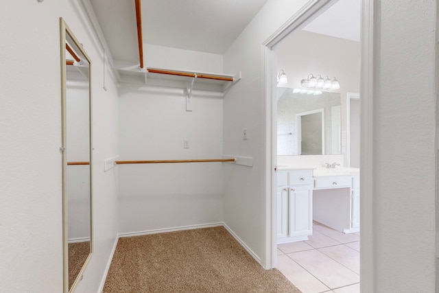 1720 Willow Crk, Mesquite, TX 75181 - walk in closet with light carpet and light tile patterned flooring