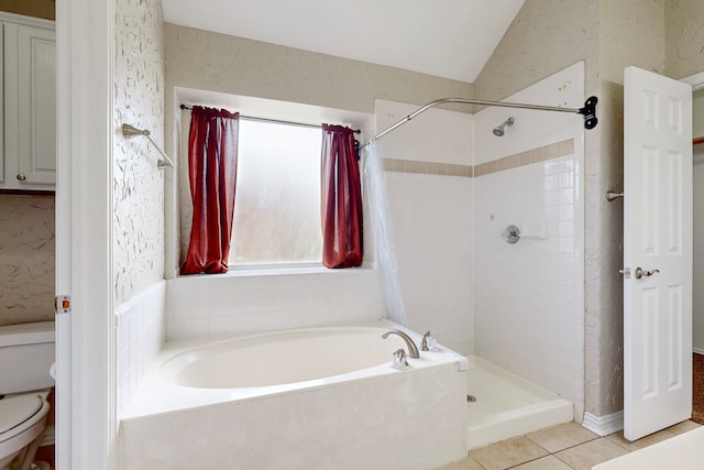 bathroom with lofted ceiling, toilet, independent shower and bath, and tile patterned flooring