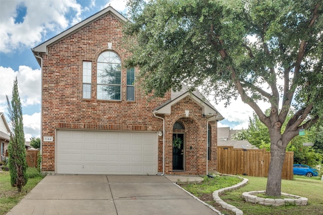 front facade featuring a garage and a front lawn