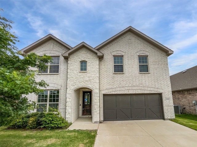 6416 Texas Cowboy Dr, Fort Worth, TX 76123 - french country style house featuring central AC unit, an attached garage, concrete driveway, and brick siding