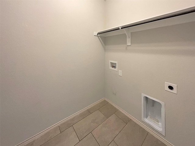 laundry room with electric dryer hookup, washer hookup, and tile patterned floors