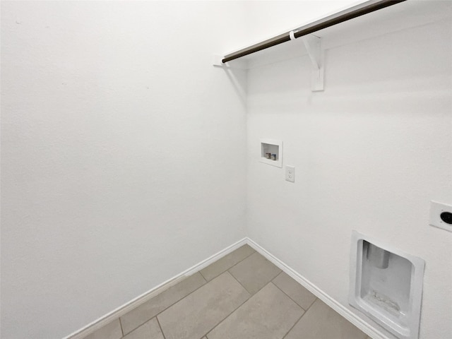6416 Texas Cowboy Dr, Fort Worth, TX 76123 - laundry area with electric dryer hookup, washer hookup, baseboards, and light tile patterned floors