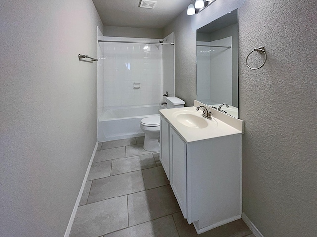 full bathroom with vanity, tile patterned flooring, tiled shower / bath combo, and toilet