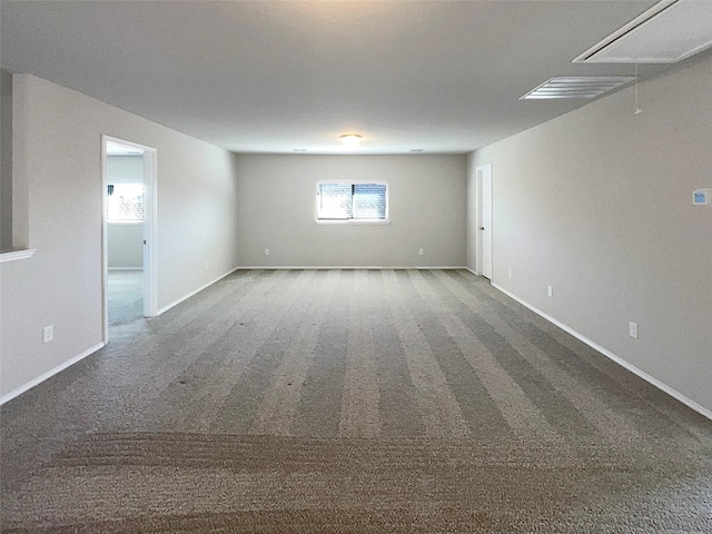 empty room with dark colored carpet