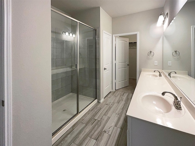 bathroom with vanity and an enclosed shower