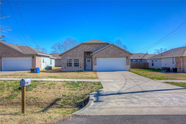 ranch-style home featuring a garage and a front yard