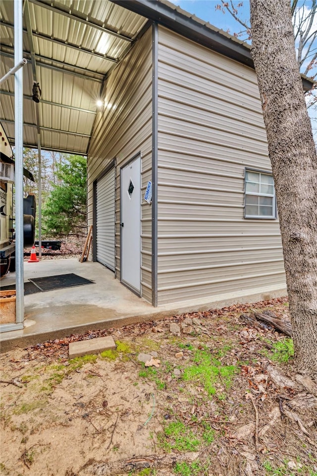 view of property exterior with a patio area