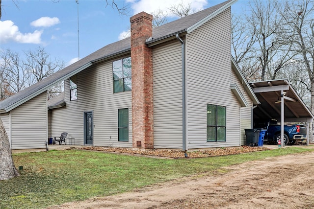 view of side of home featuring a yard