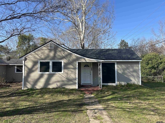 ranch-style house with a front lawn