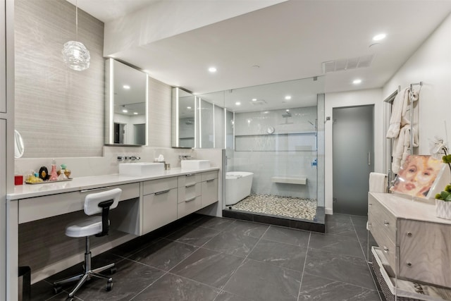 bathroom featuring vanity and a shower with shower door