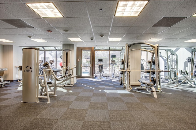 workout area featuring a paneled ceiling