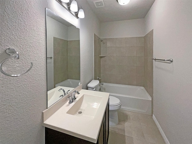 full bathroom with vanity, toilet, and tiled shower / bath combo