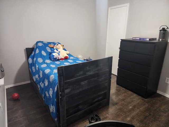 bedroom featuring dark hardwood / wood-style floors