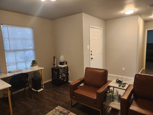 sitting room featuring dark hardwood / wood-style flooring