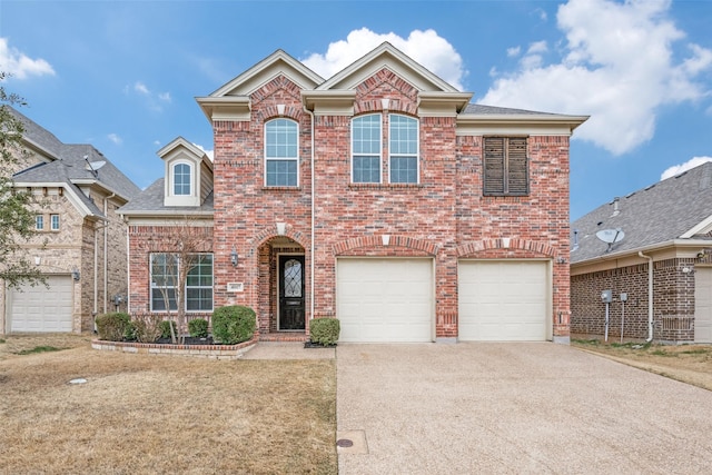 traditional-style house featuring brick siding, driveway, and an attached garage