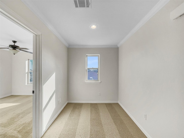 carpeted spare room with ornamental molding and ceiling fan