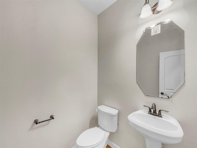 bathroom with sink and toilet