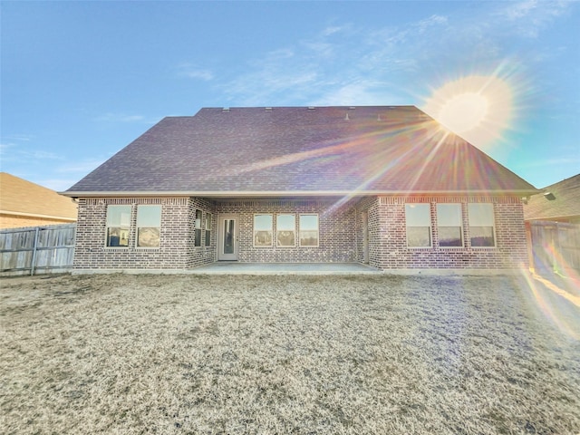 rear view of house with a patio