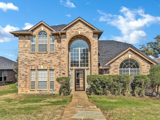 view of front of house with a front lawn