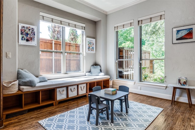 sitting room featuring crown molding and hardwood / wood-style flooring