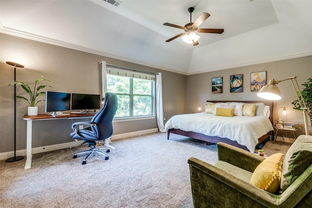 carpeted bedroom with vaulted ceiling, ornamental molding, and ceiling fan