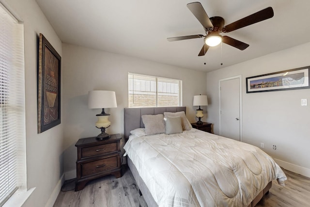 bedroom featuring ceiling fan and light hardwood / wood-style floors