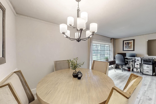 dining area featuring a notable chandelier and light hardwood / wood-style flooring