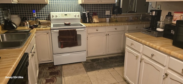 kitchen with sink, light tile patterned floors, white range with electric stovetop, and decorative backsplash