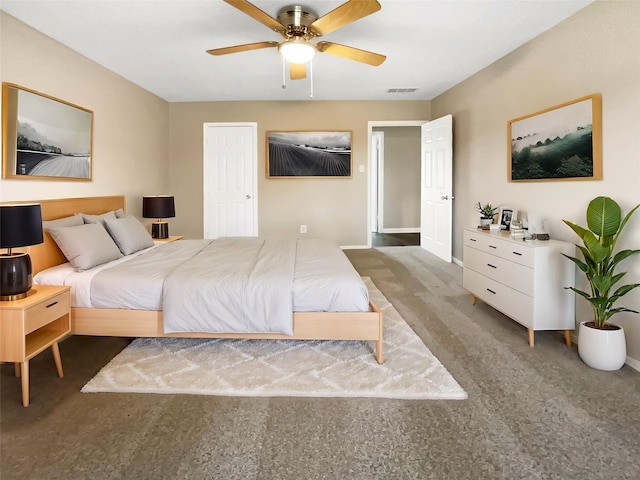 bedroom with ceiling fan and carpet