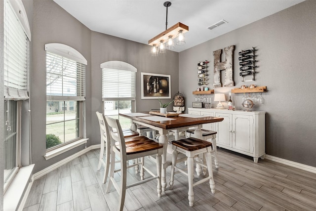 dining area featuring a chandelier