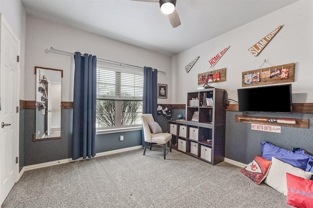 living area with ceiling fan and carpet floors