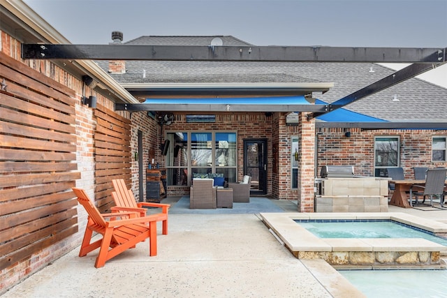 view of patio with an in ground hot tub