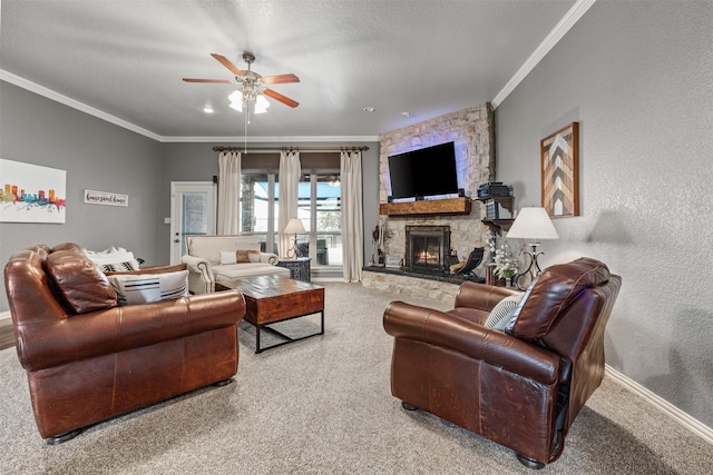 living room with ceiling fan, carpet floors, ornamental molding, a textured ceiling, and a stone fireplace