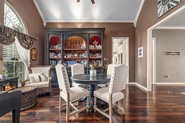 dining room with ornamental molding, dark hardwood / wood-style floors, and ceiling fan